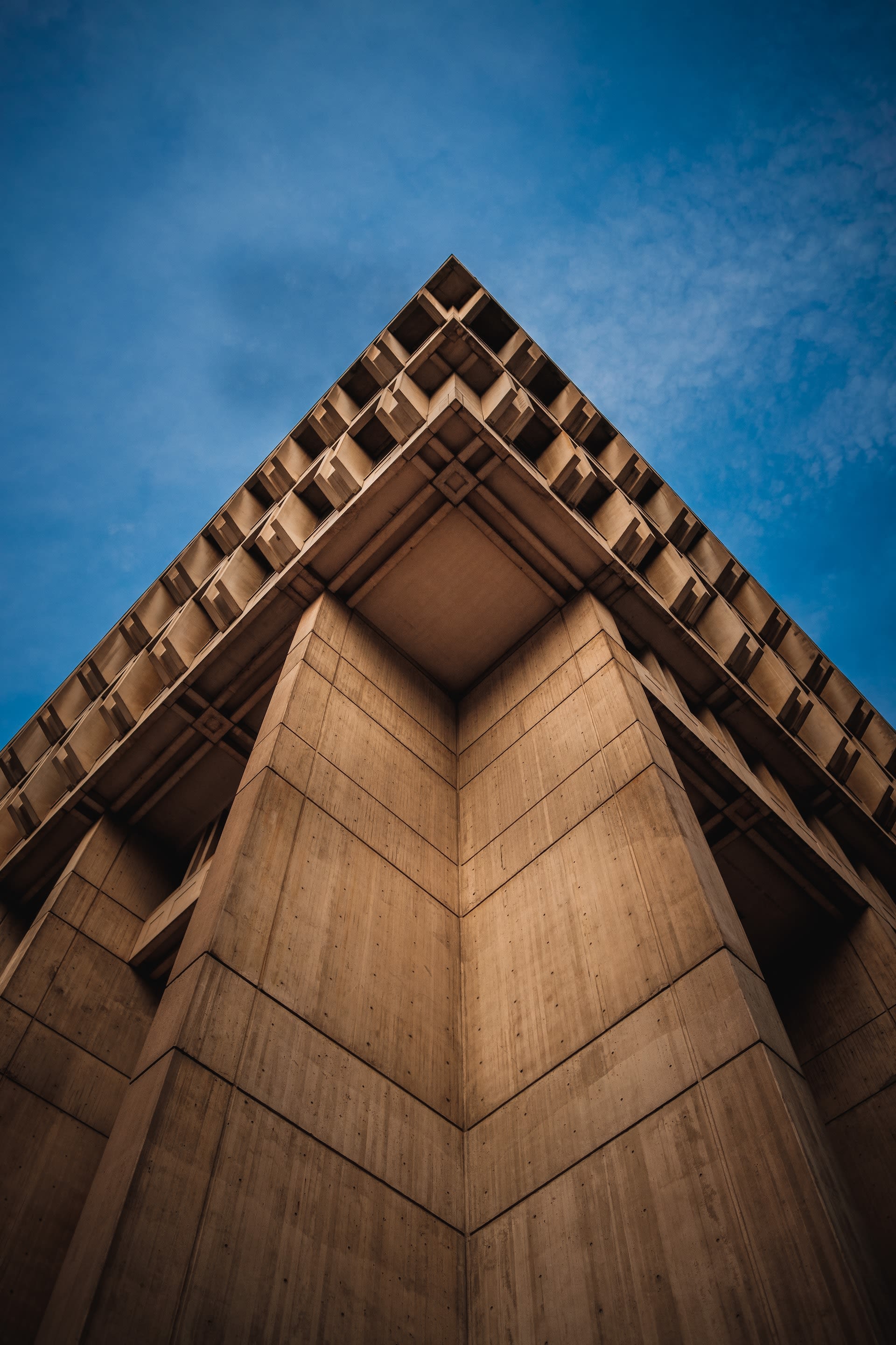 Triangular rooftop against blue sky